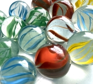 Picture of M220 25MM transparent clear with orange, yellow, blue, green swirls glass marbles